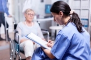 nurse-writing-prescription-disabled-senior-woman-wheelchair-after-medical-examination_482257-8485-1024x683